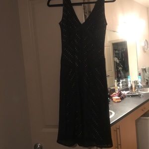 Black cocktail dress with sheer underlay
